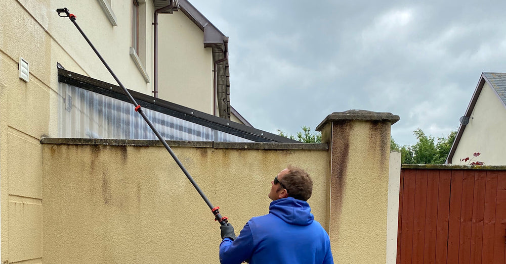 What's the most effective way to soft wash wall render?